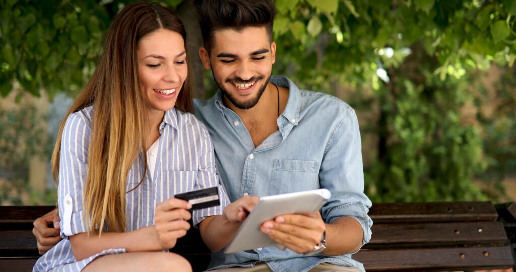 Happy couple doing shopping on internet